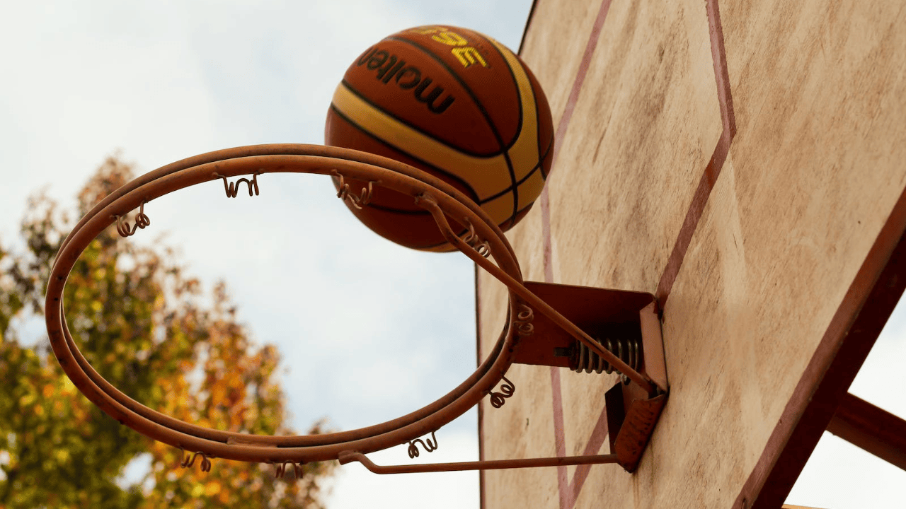 basketball going into a basketball hoop