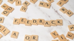 Letter tiles that spell out "feedback"