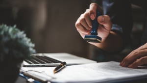 Agent about to stamp the paper