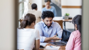Agent talking to 2 women about their loan