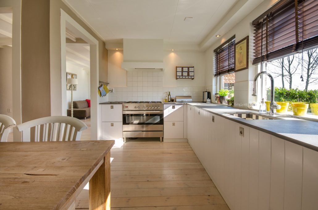 Photo of large white kitchen. Lenders will usually lend against a property with two kitchens IF both kitchens have permits.