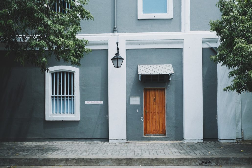 gray-house-with-wooden-door