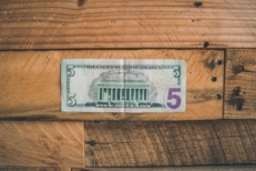 five-dollars-on-table