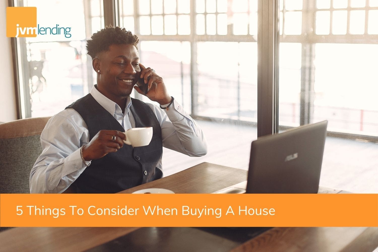 A homebuyer is on the phone with a mortgage analyst while looking up the 5 things every buyer should consider when purchasing a home.