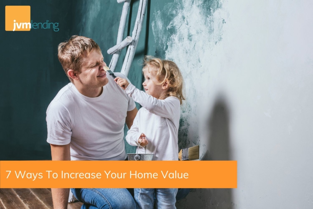 Father and young daughter showing one of the seven ways to increase home value by painting the interior of their home