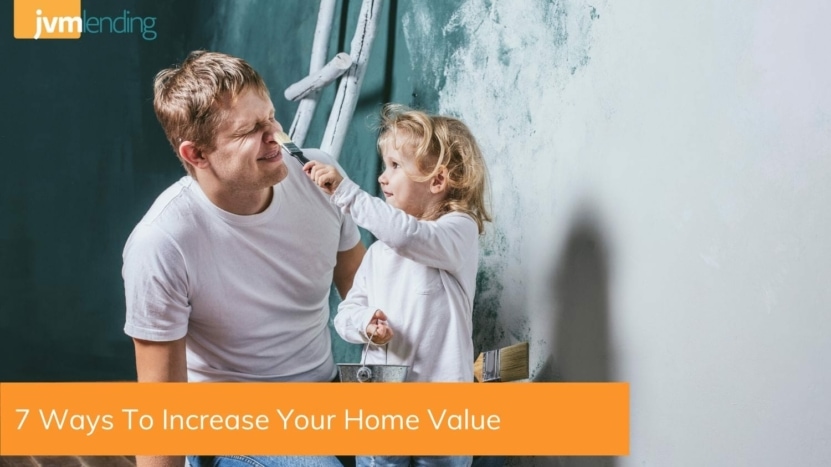 Father and young daughter showing one of the seven ways to increase home value by painting the interior of their home