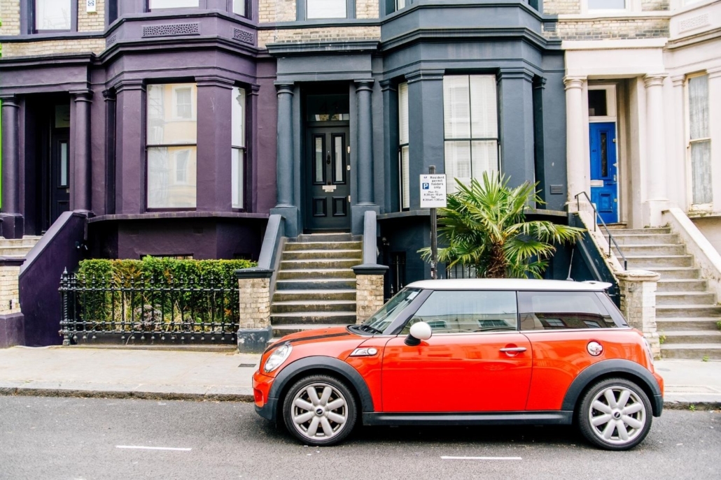 red Mini Cooper car parked in front of San Francisco homes
