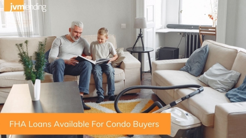 A father and a son sit together on a couch in a condo that was purchased using an FHA loan because of the new guidelines for condo buyers.