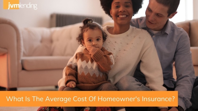 A family sits together in their living room that they were able to purchase after obtaining a competitive homeowner's insurance policy rate.