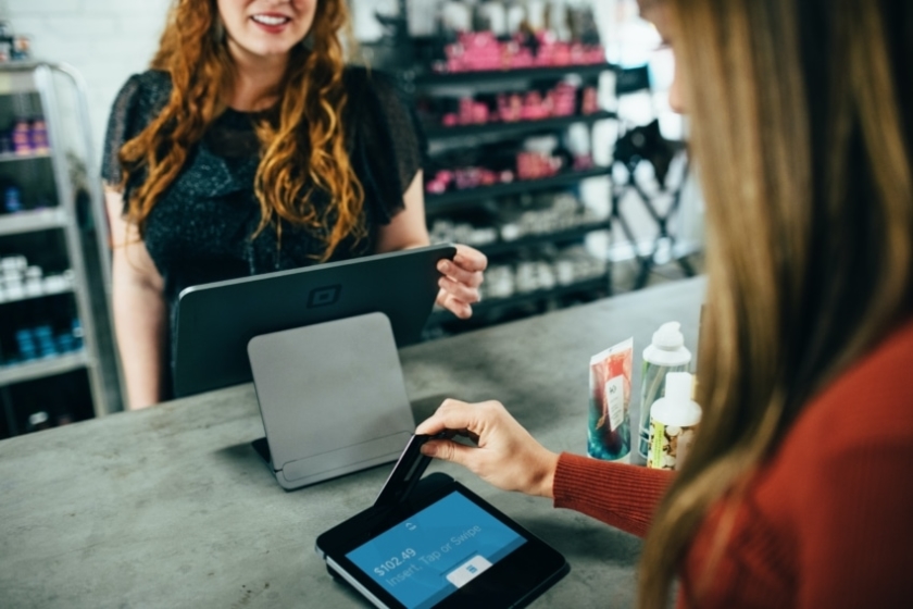 A woman uses a credit card to pay for a retail store purchase. Jumbo investors especially want to see that buyers have multiple credit accounts open and seasoned.
