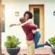 Couple hugs in celebration of buying a home