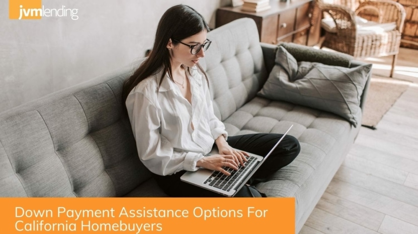 A prospective homebuyer in California researches down payment assistance programs on her laptop computer at home.
