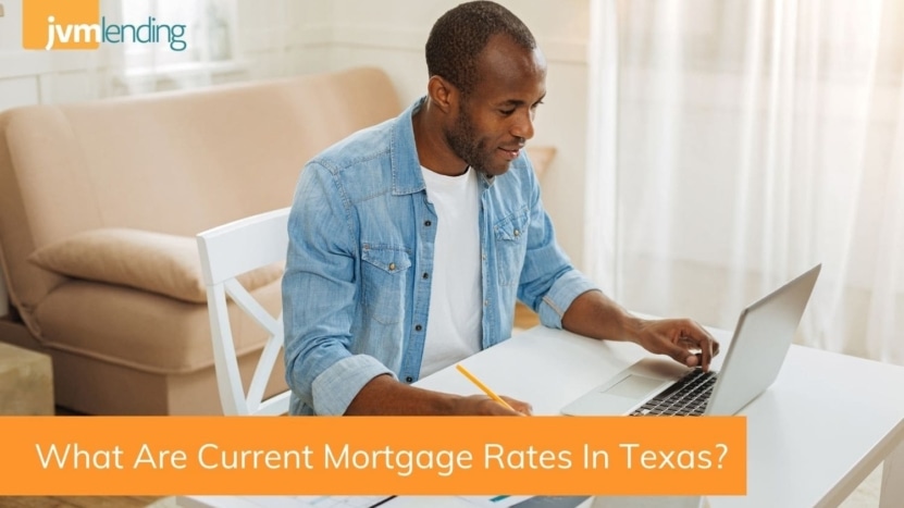 A man looks up the average mortgage rates for a home loan in Texas on his laptop computer at home.