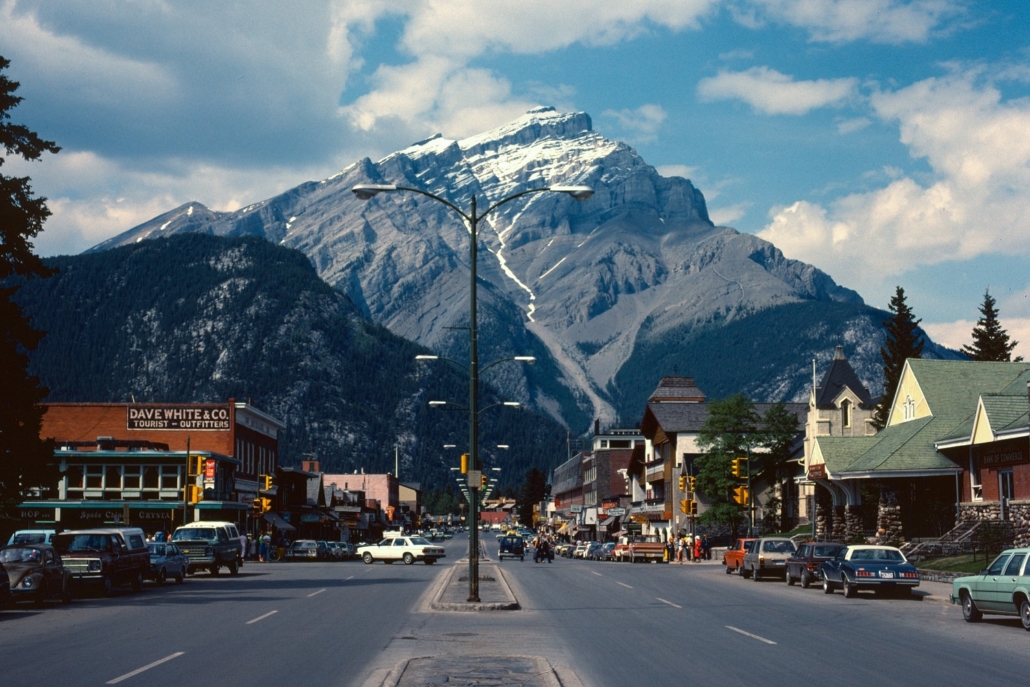 A town in the 1908s with a picturesque view of the mountains has many homes and businesses that were affected by inflation which impact their nominal and real rates for any loans used to purchase property.