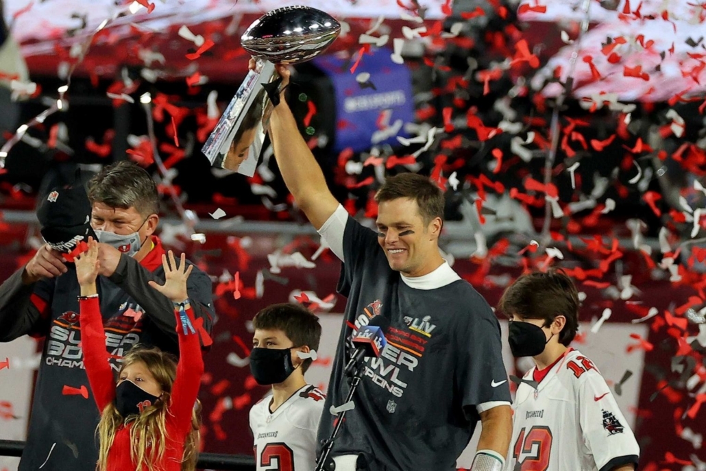 Tampa Bay Buccaneers Quarterback Tom Brady holds up his 7th Super Bowl trophy