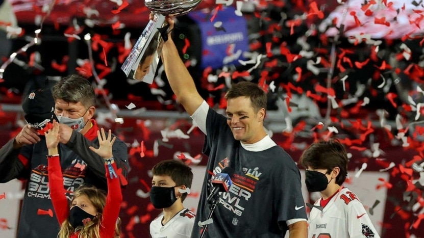 Tom Brady holds up his 7th Super Bowl trophy