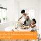 A young family sits together in the kitchen of the home they purchased using a conventional loan.