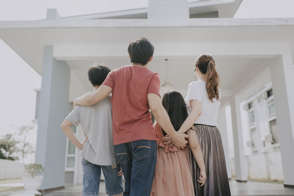 an asian chinese family moving into new house admiring their house