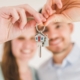 A couple holding a key to their new home