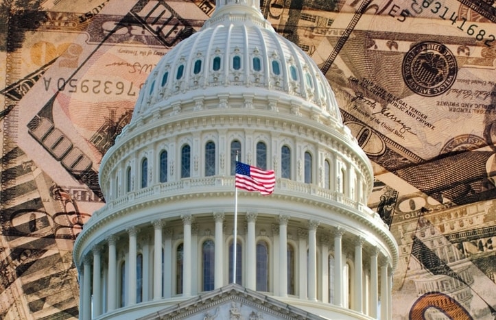 U.S. Capitol Building with U.S. dollar bills in the background.