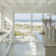 Modern white kitchen with ocean view in a home bought with an asset-based loan