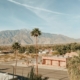 View of deserts in Southern California with mountains and palm trees.