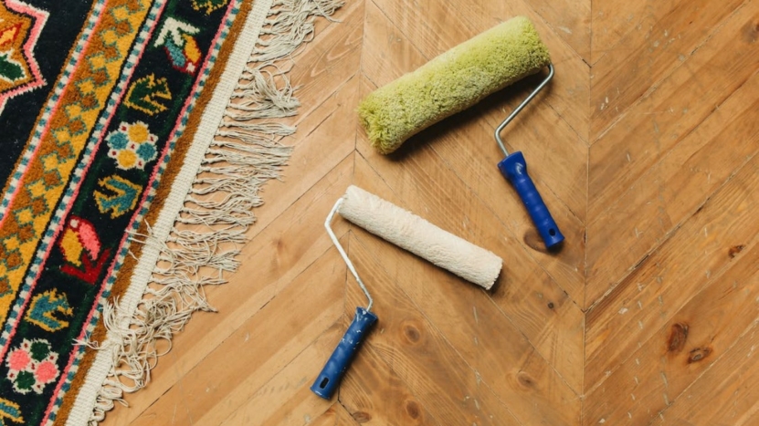 Paint Rollers Lying on a Wooden Floor During A Home Renovation