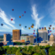 Cloudy sky over Boise with many hot air balloons