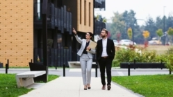 Real estate investors walking and viewing new properties together