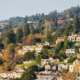 Aerial view of residential neighborhood built on a hill on a sunny autumn day, Berkeley, San Francisco Bay, California