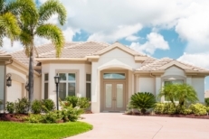 A nice home in Florida with palm trees and landscaping