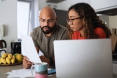Couple doing home finances together at home