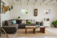A living room with white walls and wooden floors