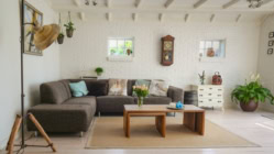 A living room with white walls and wooden floors