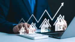 Real Estate Investment and Market Growth Concept. Analyzes real estate market growth trends. Graph show rising house price, interest rate, property mortgage, loan home, and investment opportunities.