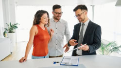 Couple house property agent home tablet technology business buying investment real estate apartment showroom contract keys