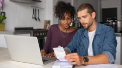 Couple realizing the Economic Headwinds That Will Bring Rates Down