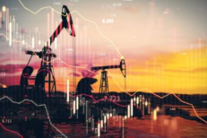 Oil pumpjacks at sunset with financial charts overlay