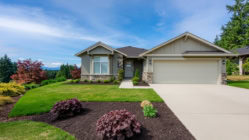 A picture of a house and it's driveway