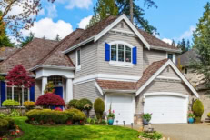 Large Luxury Suburban Home Beautiful Landscaped Lush Green Front Yard Lawn Trees