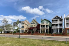A picture of a line of houses with different colors.