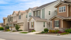 Suburban homes seen from the street in a suburban neighborhood