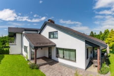 A cozy home with great backyard and cleanly mown lawn.