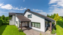 A cozy home with great backyard and cleanly mown lawn.